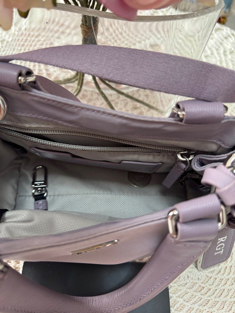 Tumi Voyageur Carson Crossbody Bag (Category: Luxury Bags & Wallets) located in Marikina City. Submitted by bee031297 (Listing ID 1397092140, Image 2). Description: - Tumi Voyageur Carson crossbody bag - Lavender color - Top handle and detachable shoulder strap - Zippered side pocket - Main compartment with interior pocket - Gray interior lining - Includes Tumi tag and card.