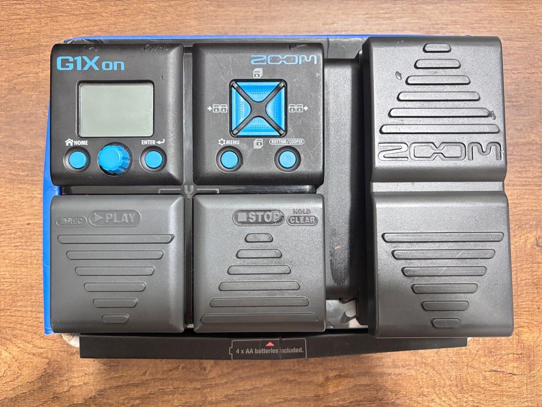 Zoom G1Xon Guitar Effects Pedal (Category: Musical Instruments) located in Cavite. Submitted by john.marinel (Listing ID 1397059150, Image 1). Description: Zoom G1Xon guitar effects pedal. Features a display screen, control knobs, and multiple foot pedals for various effects. Includes a 'REC' and 'PLAY' pedal, as well as a 'STOP' and 'CLEAR' pedal. The unit is powered by 4 x AA batteries..