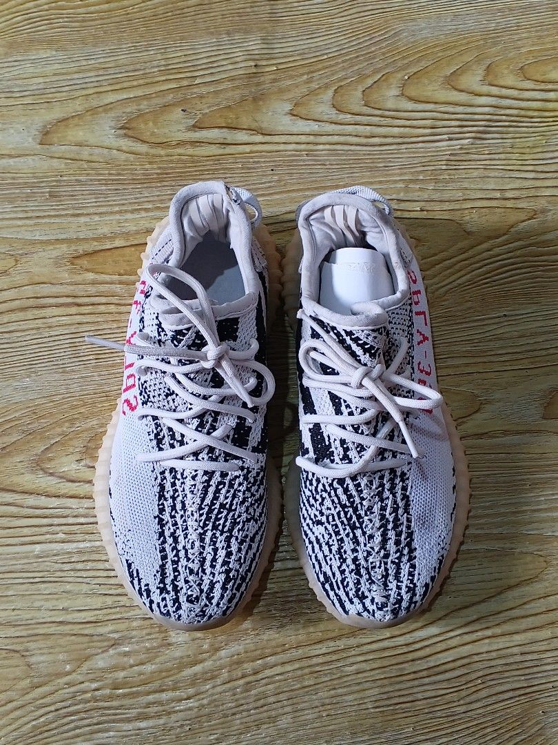 Adidas Yeezy Boost 350 V2 Zebra (Category: Sneakers) located in Manila. Submitted by thriftnijuls (Listing ID 1397245540, Image 2). Description: - Adidas Yeezy Boost 350 V2 Zebra sneakers - US size 6.5, UK size 6 - White and black Primeknit upper - Signature side stripe - Red "SPLY-350" text - Manufacturing date: 01/20.