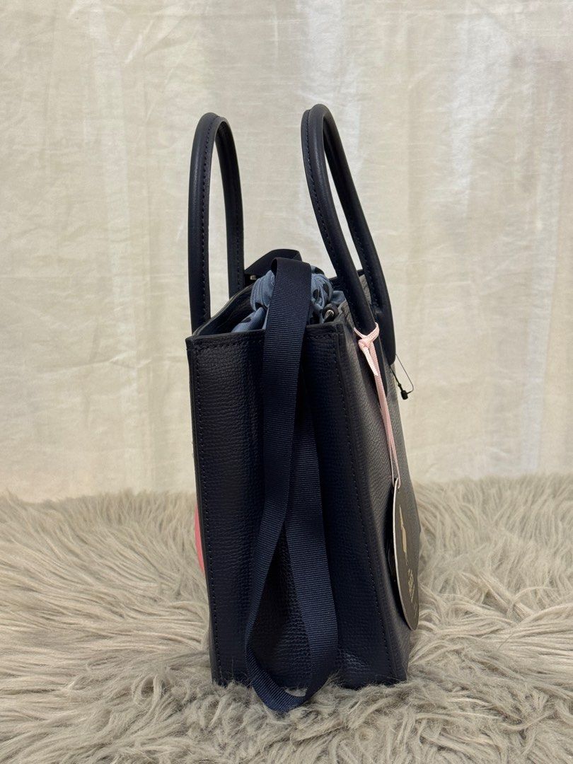 Authentic Kate Spade Two-way bag (Category: Luxury Bags & Wallets) located in Paoay. Submitted by ysmattic (Listing ID 1397265236, Image 3). Description: 100% guaranteed authentic Kate Spade x Alice Disney two-way bag in excellent condition. Comes with strap, cards and tags. Can be given as gift. .