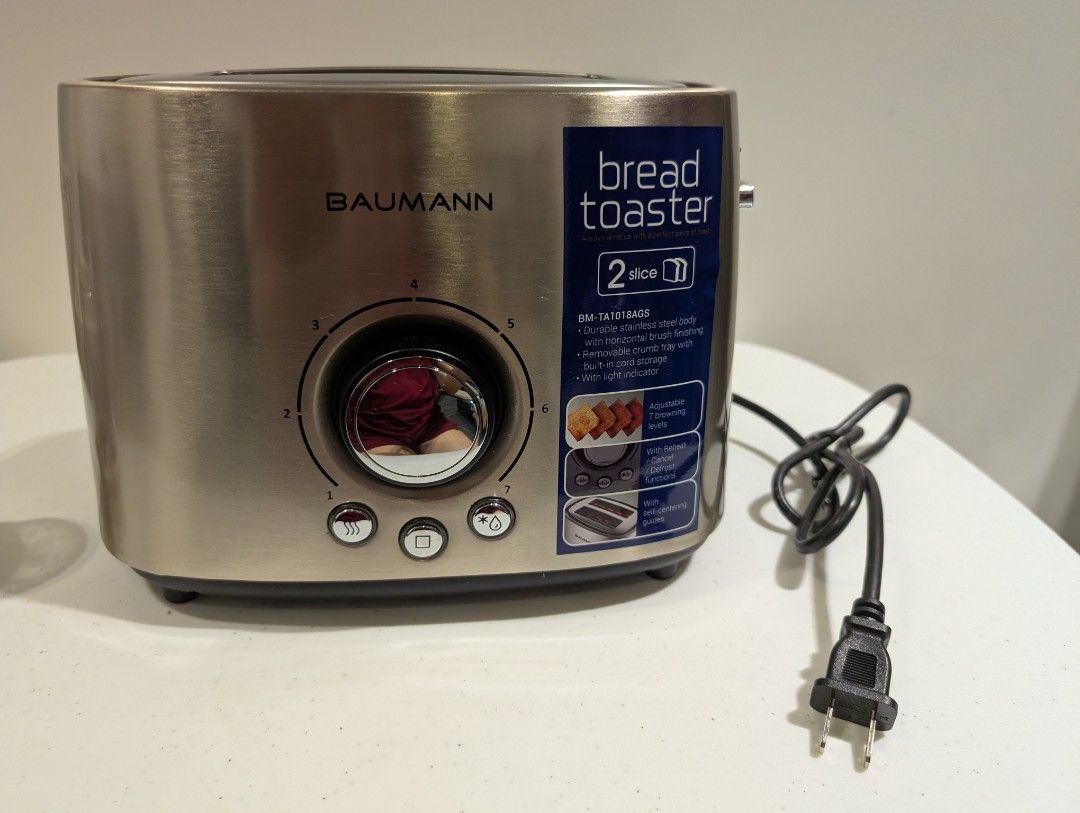Baumann 2-Slice Bread Toaster (Category: Ovens & Toasters) located in Manila. Submitted by coolshark888 (Listing ID 1397242669, Image 1). Description: - Baumann 2-slice toaster - Stainless steel finish - Adjustable toasting level dial - Multiple toasting function buttons - Removable crumb tray for easy cleaning - Power cord included.