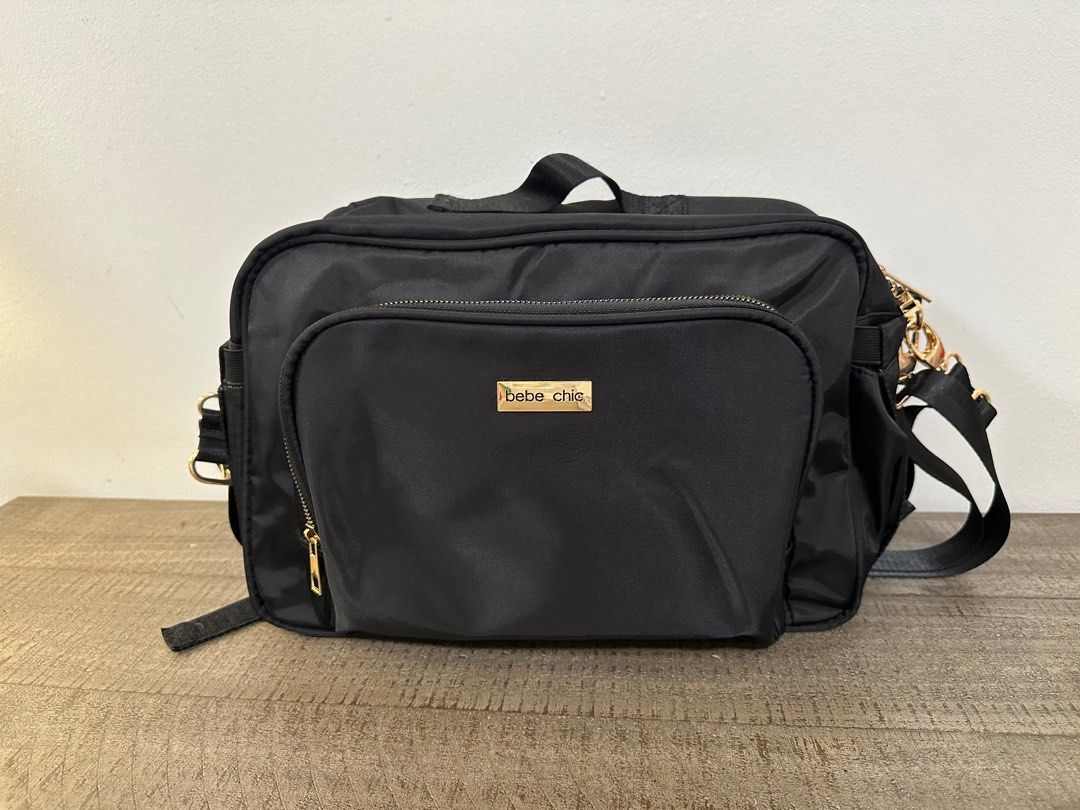 Bebe Chic Addison Stroller Bag- Black (Category: Diaper Bags & Wetbags) located in Makati City. Submitted by msmingchin (Listing ID 1397362526, Image 2). Description: Features: Made of soft, smooth polyester with gold zippers Exterior: One front zippered pocket with organizer pockets inside Two side pockets One back zippered pocket Main compartment: One zippered pocket One slip pocket Two insulated side pockets One gartered pocket Accessories: Sh