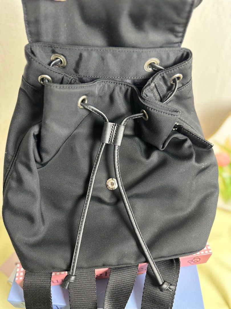 Coach Black Mini Backpack (Category: Luxury Bags & Wallets) located in Cagayan de Oro. Submitted by thecdobags (Listing ID 1397335505, Image 2). Description: - Authentic Coach mini backpack - Color: Black - Adjustable shoulder straps - Drawstring closure with buckle flap - Interior Coach label - Top handle - Small zippered pocket on the back - Includes Coach tag.