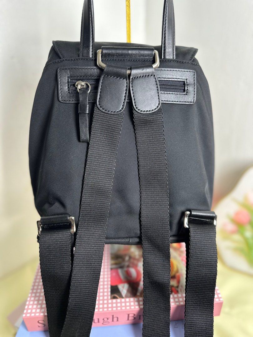 Coach Black Mini Backpack (Category: Luxury Bags & Wallets) located in Cagayan de Oro. Submitted by thecdobags (Listing ID 1397335505, Image 3). Description: - Authentic Coach mini backpack - Color: Black - Adjustable shoulder straps - Drawstring closure with buckle flap - Interior Coach label - Top handle - Small zippered pocket on the back - Includes Coach tag.