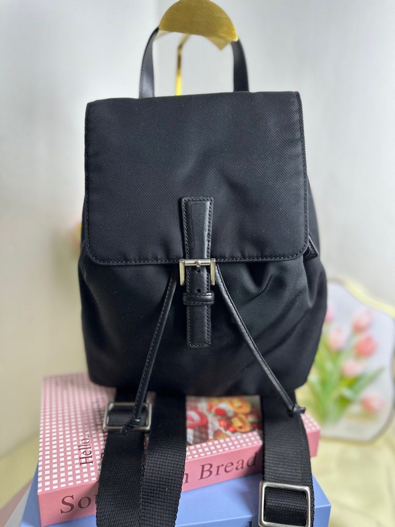 Coach Black Mini Backpack (Category: Luxury Bags & Wallets) located in Cagayan de Oro. Submitted by thecdobags (Listing ID 1397335505, Image 1). Description: - Authentic Coach mini backpack - Color: Black - Adjustable shoulder straps - Drawstring closure with buckle flap - Interior Coach label - Top handle - Small zippered pocket on the back - Includes Coach tag.