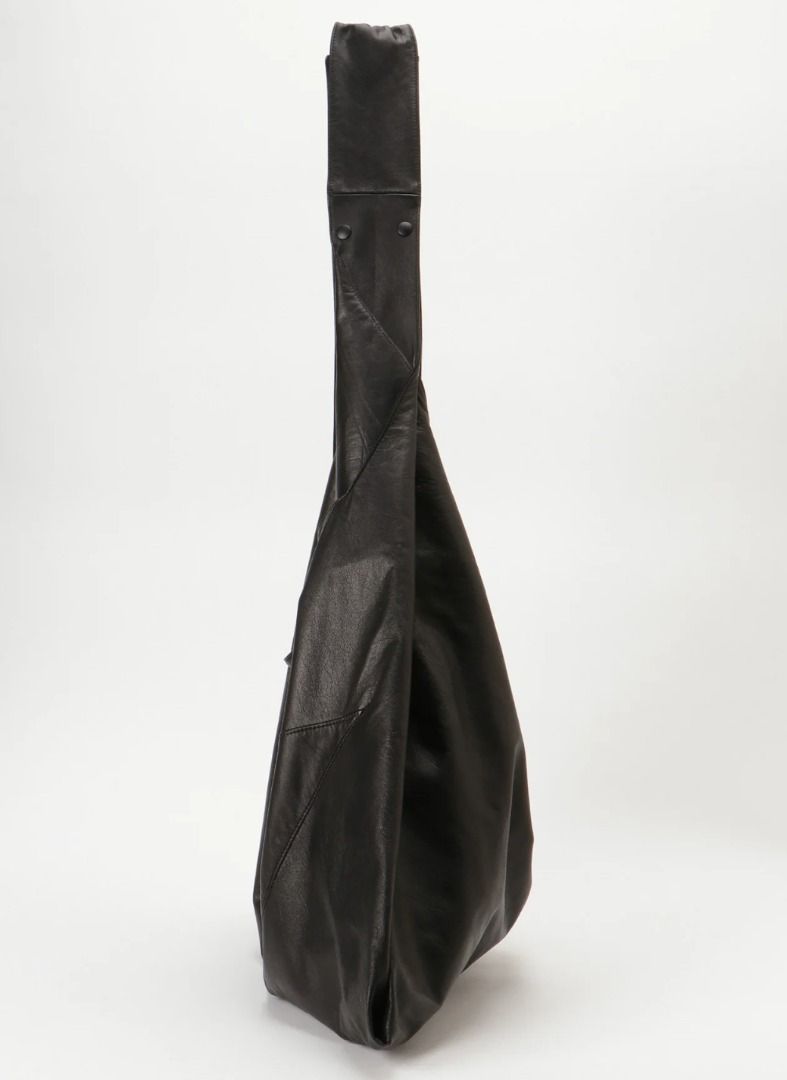 discord Yohji Yamamoto - Infinite Bag (Big) (Category: Bags & Wallets) located in Singapore. Submitted by kanerayn (Listing ID 1397349000, Image 3). Description: This discord Yohji Yamamoto bag is a transformed version of the iconic "INFINITY" bag, offering versatility as a shoulder or hand bag. It features an expanded width and asymmetric design with adjustable shoulder length via dot buttons. - Transformed "INFINITY" bag with wider dimensions. 