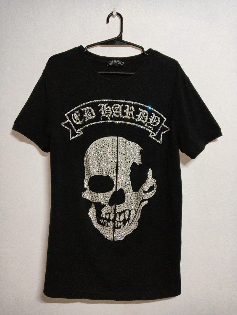 ED HARDY SKULL COLLECTION (Category: Shirts) located in Manila. Submitted by c4pybr (Listing ID 1397391020, Image 1). Description: 600 SHIPPED FEW MISSING RHINESTONES L - 28 W - 18.5 SLEEVES - 8 NEGOTIABLE!!.