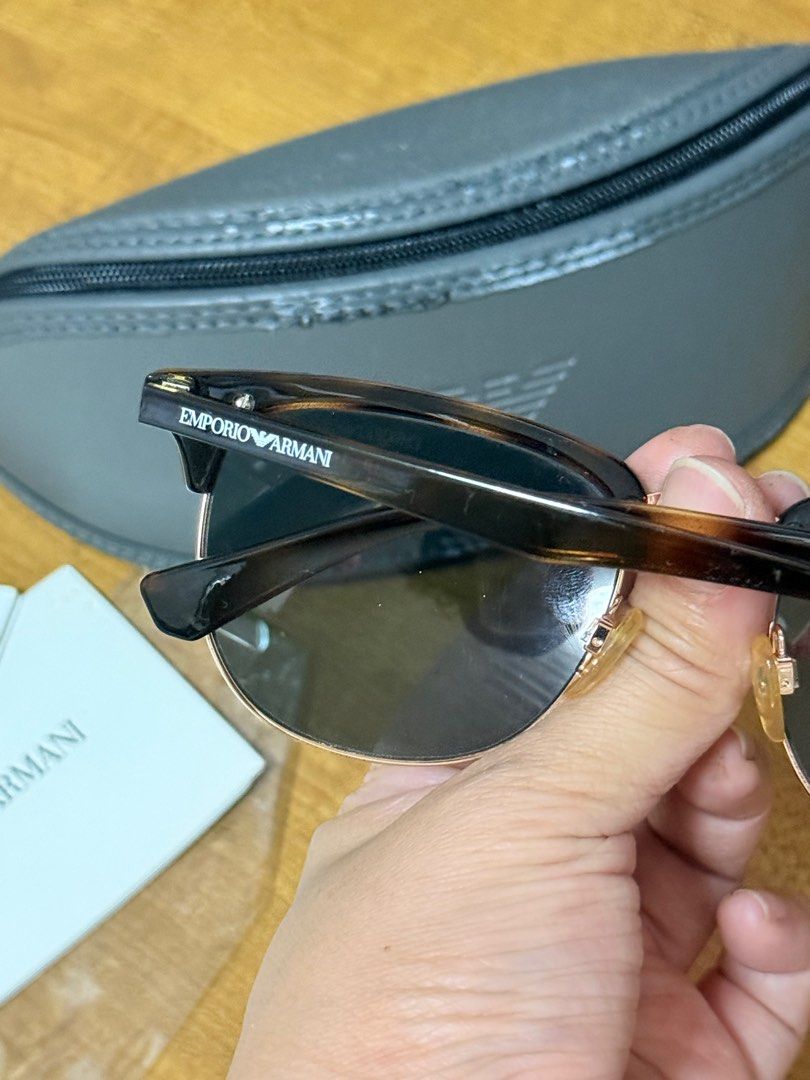 Emporio Armani Sunglasses (Category: Sunglasses & Eyewear) located in Quezon City. Submitted by beabeys (Listing ID 1397331672, Image 3). Description: - Emporio Armani sunglasses - Model: EA 4072 (52 19 140 3N) - Unique brown and gold frame design - Pink reflective lenses - Includes original case and paperwork .