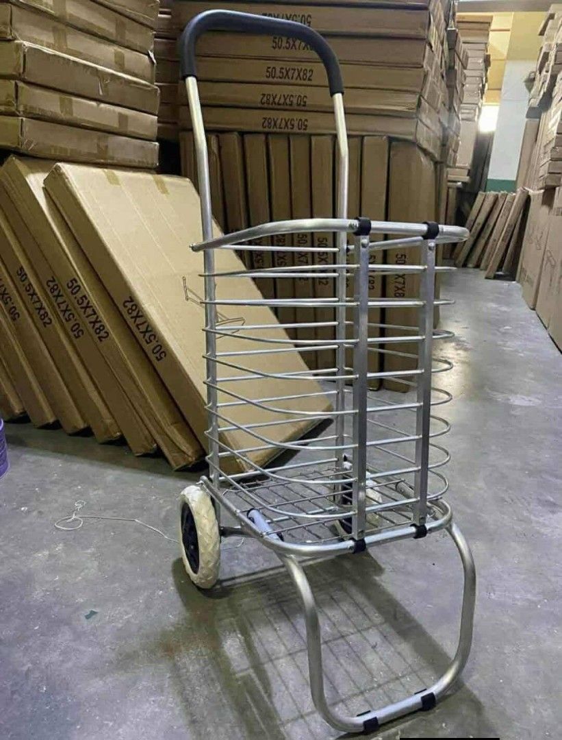 Foldable Shopping Cart (Category: Storage Boxes & Baskets) located in Manila. Submitted by lyfrancois14 (Listing ID 1397281315, Image 1). Description: - Foldable design for easy storage - Sturdy metal frame - Spacious basket for groceries and more - Two wheels for easy maneuverability - Comfortable handle for pulling - Ideal for carrying various items.
