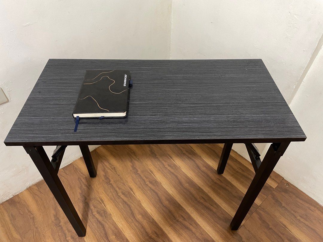 Foldable Study Table - Black (Category: Tables & Sets) located in Quezon City. Submitted by mikeconde (Listing ID 1397244431, Image 1). Description: - Foldable study table - Sleek black design - Rectangular tabletop - Sturdy legs - Compact size, ideal for small spaces - Perfect for studying or working from home - Easy storage due to foldable design.