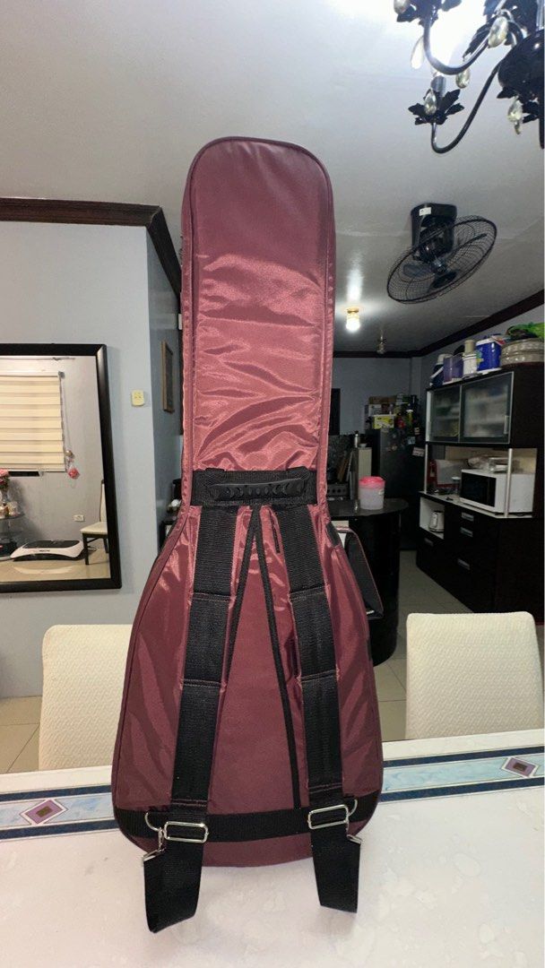 GIBSON PREMIUM ACOUSTIC SOFTCASE GUITAR CASE (Category: Musical Instruments) located in Taytay. Submitted by ace2020 (Listing ID 1397407176, Image 3). Description: 17k VALUE ONLINE - Metallic Burgundy Gibson guitar case - Black straps - Zipper closure - Front pocket - Handle for carrying - Backpack straps for easy transport - Gibson logo on front -GUITAR CASE ONLY🥰 .