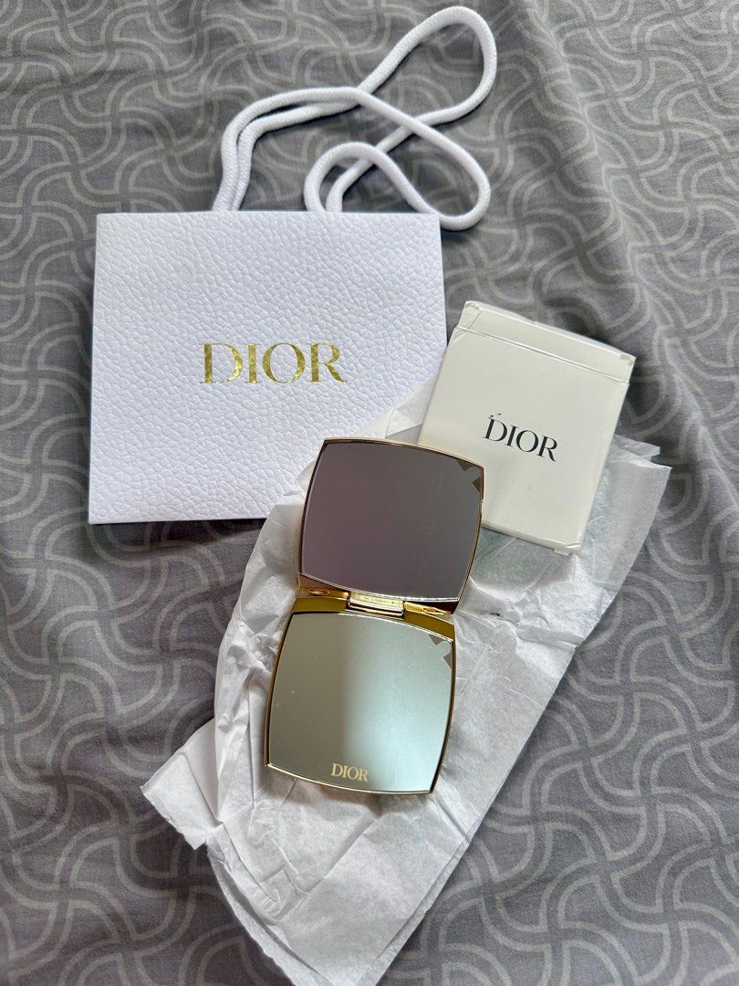 GWP Dior Compact Mirror (Category: Mirrors) located in Cebu City. Submitted by worthitsizzums (Listing ID 1397234915, Image 3). Description: - Authentic Dior Gift with purchase compact mirror - Includes original box and Dior paper bag - Gold-colored exterior with Dior logo - Opens to reveal two mirrors .