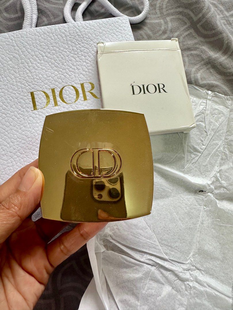 GWP Dior Compact Mirror (Category: Mirrors) located in Cebu City. Submitted by worthitsizzums (Listing ID 1397234915, Image 1). Description: - Authentic Dior Gift with purchase compact mirror - Includes original box and Dior paper bag - Gold-colored exterior with Dior logo - Opens to reveal two mirrors .