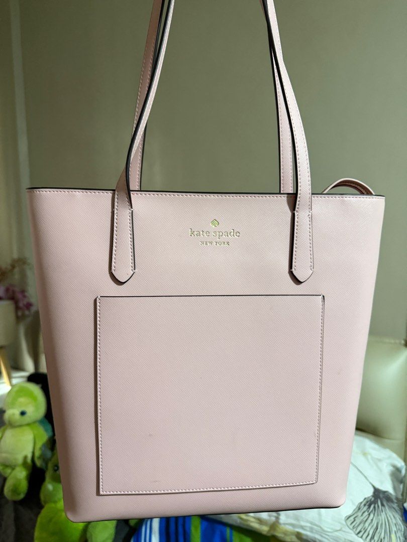 Kate Spade Chalk Pink Tote Bag (Category: Tote Bags) located in Quezon City. Submitted by declutteringseller8 (Listing ID 1397223778, Image 1). Description: - Kate Spade pink tote bag - Sleek design - Features two top handles - Made of smooth material - Perfect for everyday use - Simple and elegant design.