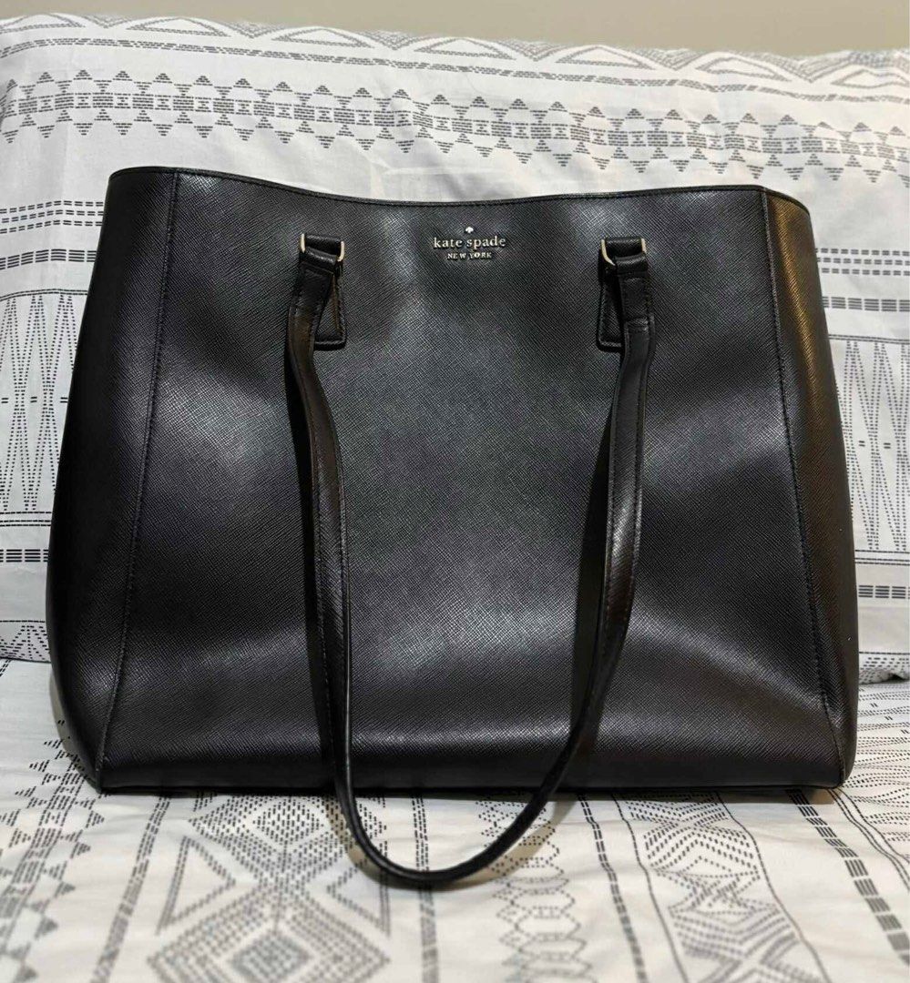 Kate Spade Perry Leather Laptop Tote (Category: Tote Bags) located in Mandaluyong City. Submitted by kthln (Listing ID 1394784964, Image 2). Description: Decluttering, cannot fit my new work laptop so might as well just sell. Purchased in the US. SF to be arranged and shouldered by buyer. Product details from Kate Spade site: 13.2” W x 12.16” H x 5.6” D Handle Drop: 11.5” Metal pinmount logo exterior: top zip compartment Two way spade jacquard li