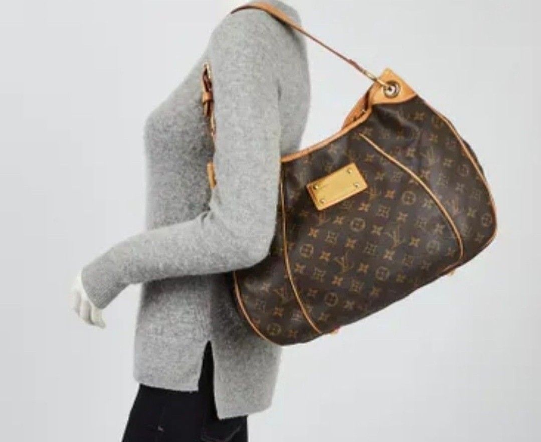 Louis Vuitton Monogram Canvas Hobo Bag (Category: Luxury Bags & Wallets) located in Manila. Submitted by rcloset___ (Listing ID 1397260511, Image 2). Description: - Authentic Louis Vuitton handbag - Iconic Monogram canvas - Hobo style with curved shape - Leather trim - Shoulder strap - Metal hardware - Red fabric lining - Stylish and recognizable design.