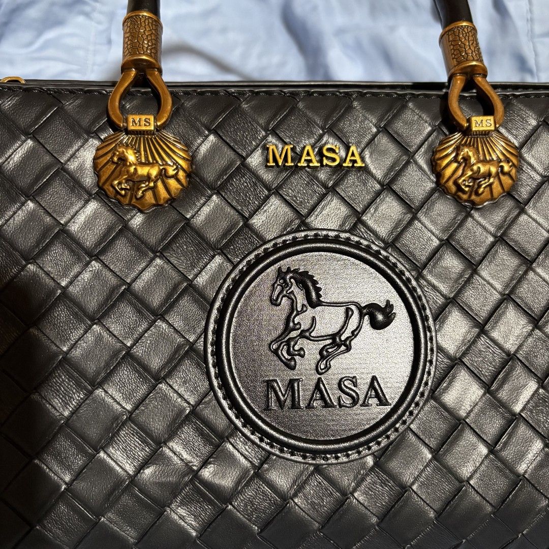 MASA Leather Bag - Black (Category: Luxury Bags & Wallets) located in Manila. Submitted by mdc08 (Listing ID 1397394134, Image 3). Description: **REPRICED** ▪︎Used once, with tags (detached) ▪︎Black leather body in weave pattern, black leather handle, and black leather detachable, belt (adjustable) strap ▪︎Hardware: gold-toned vintage; brand engraved on zipper pulls ▪︎Main compartment: suede/leather lining, 3 open compartments with 1 open pocket 