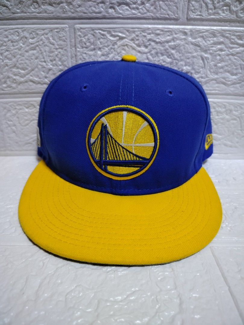 New Era Golden State Warriors Finals Cap (Category: Caps & Hats) located in Malvar. Submitted by caps_l0ck (Listing ID 1397310074, Image 2). Description: - Official New Era 9Fifty cap - Golden State Warriors design - Features a blue crown and yellow brim - Commemorates the 2017 NBA Finals - One size fits most - Includes New Era size tag.