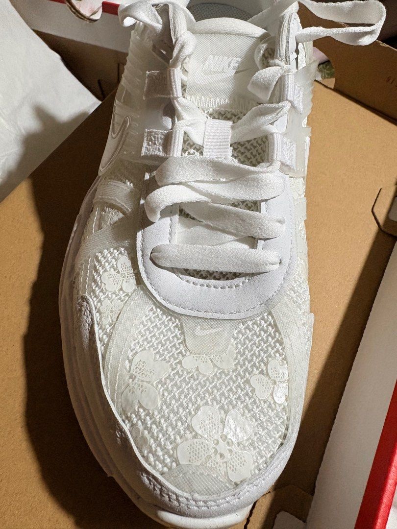 Nike W V2K Run White Sneakers (Category: Sneakers) located in Quezon City. Submitted by cupcake06 (Listing ID 1397314235, Image 1). Description: - Nike W V2K Run sneakers - White colorway - Features a white floral lace design - Size: US 8, EUR 39, CM 25 - Includes original box - New and unworn Negotiable ✅.