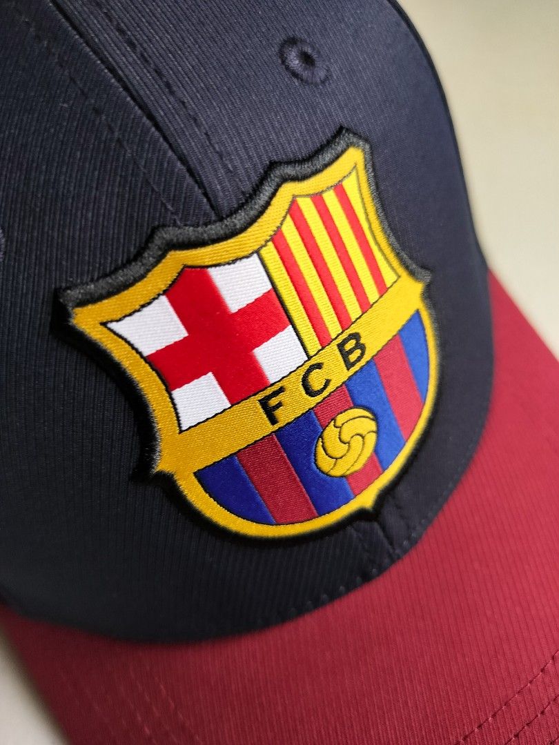Official FC Barcelona Adjustable Cap (Category: Caps & Hats) located in Rizal. Submitted by rapidrob (Listing ID 1397294248, Image 2). Description: Features team crest on the front "BARÇA" logo on the back Navy blue crown and maroon brim Adjustable strap for a comfortable fit Includes original tags.
