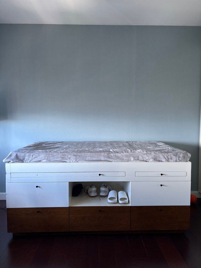 Pottery Barn Toddler Storage Bed Frame with Drawers (Category: Bed Frames & Mattresses) located in Manila. Submitted by wander55 (Listing ID 1397285121, Image 2). Description: - White and brown bed frame - Built-in storage: drawers and open compartments - Designed for a mattress - Sturdy construction - Space-saving design.