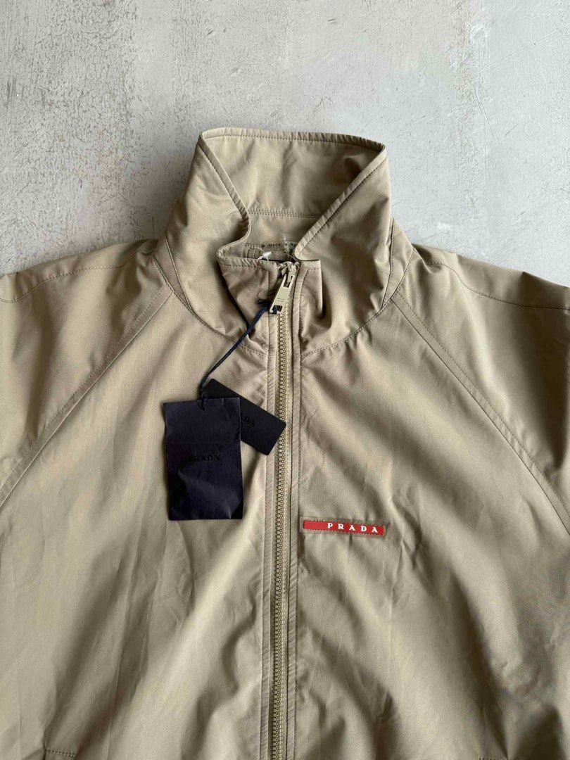 Prada Luna Rossa Track Jacket (Category: Activewear) located in Manila. Submitted by beyondarchives (Listing ID 1397281069, Image 2). Description: Size: 52 Width: 23 Length: 27 Sleeve: 25 Materials: Cotton Condition: 9/10 Issue: None.