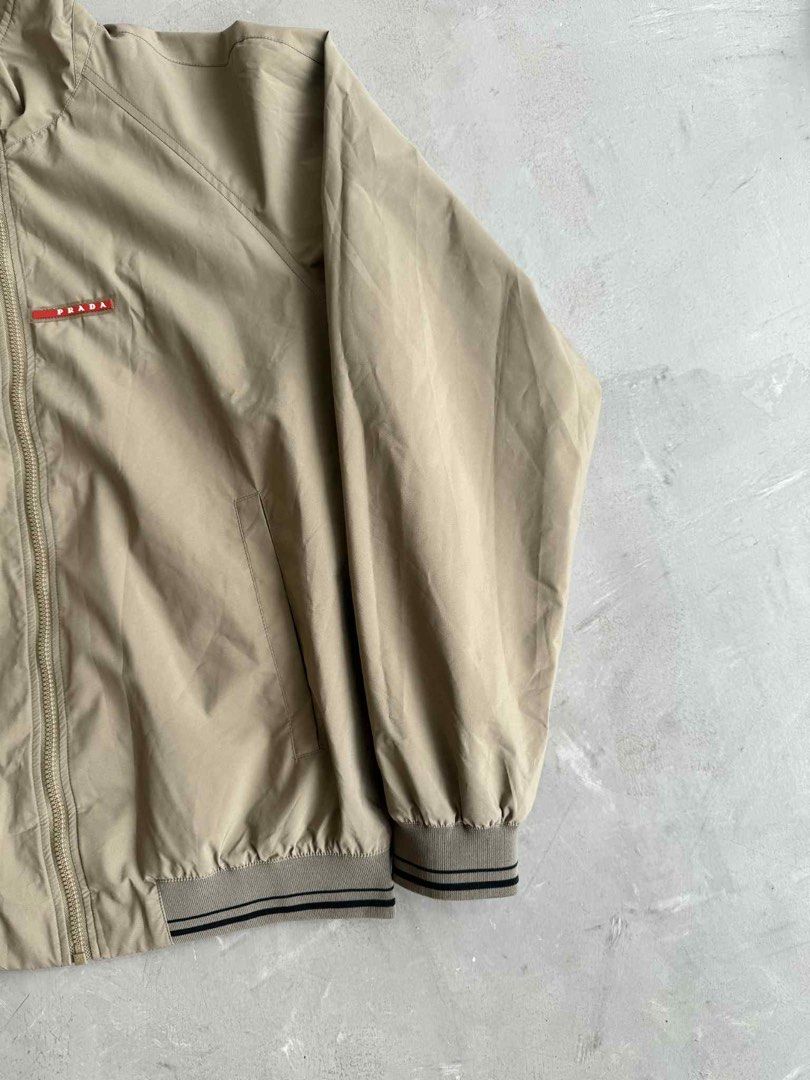 Prada Luna Rossa Track Jacket (Category: Activewear) located in Manila. Submitted by beyondarchives (Listing ID 1397281069, Image 3). Description: Size: 52 Width: 23 Length: 27 Sleeve: 25 Materials: Cotton Condition: 9/10 Issue: None.
