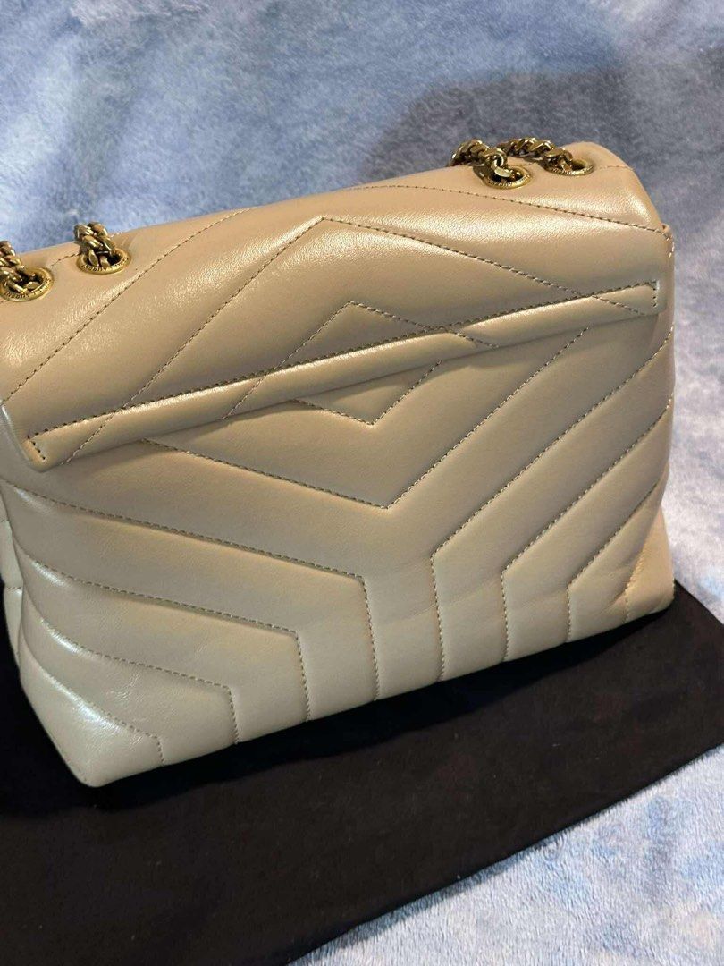 Saint Laurent LouLou Puffer Bag (Category: Luxury Bags & Wallets) located in Taguig. Submitted by handeddownshop13 (Listing ID 1397221029, Image 3). Description: - Bought in paris for Php 120,000 - Saint Laurent LouLou Puffer Bag - Quilted design - Gold-tone chain strap - Features the iconic YSL logo - Neutral color, versatile for any outfit - Includes dust bag, no box and card.