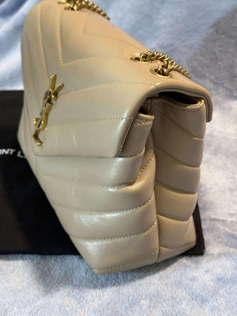 Saint Laurent LouLou Puffer Bag (Category: Luxury Bags & Wallets) located in Taguig. Submitted by handeddownshop13 (Listing ID 1397221029, Image 2). Description: - Bought in paris for Php 120,000 - Saint Laurent LouLou Puffer Bag - Quilted design - Gold-tone chain strap - Features the iconic YSL logo - Neutral color, versatile for any outfit - Includes dust bag, no box and card.