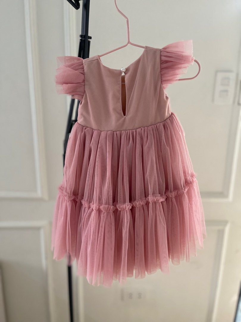 Spinkie Dress with Headband (Category: Babies & Kids Fashion) located in Paranaque City. Submitted by jamrct (Listing ID 1397374748, Image 2). Description: - Adorable pink tulle dress - Matching flower headband included - Features a layered tulle skirt - Ruffled sleeves - Keyhole back detail - Perfect for special occasions - Great for photoshoots.