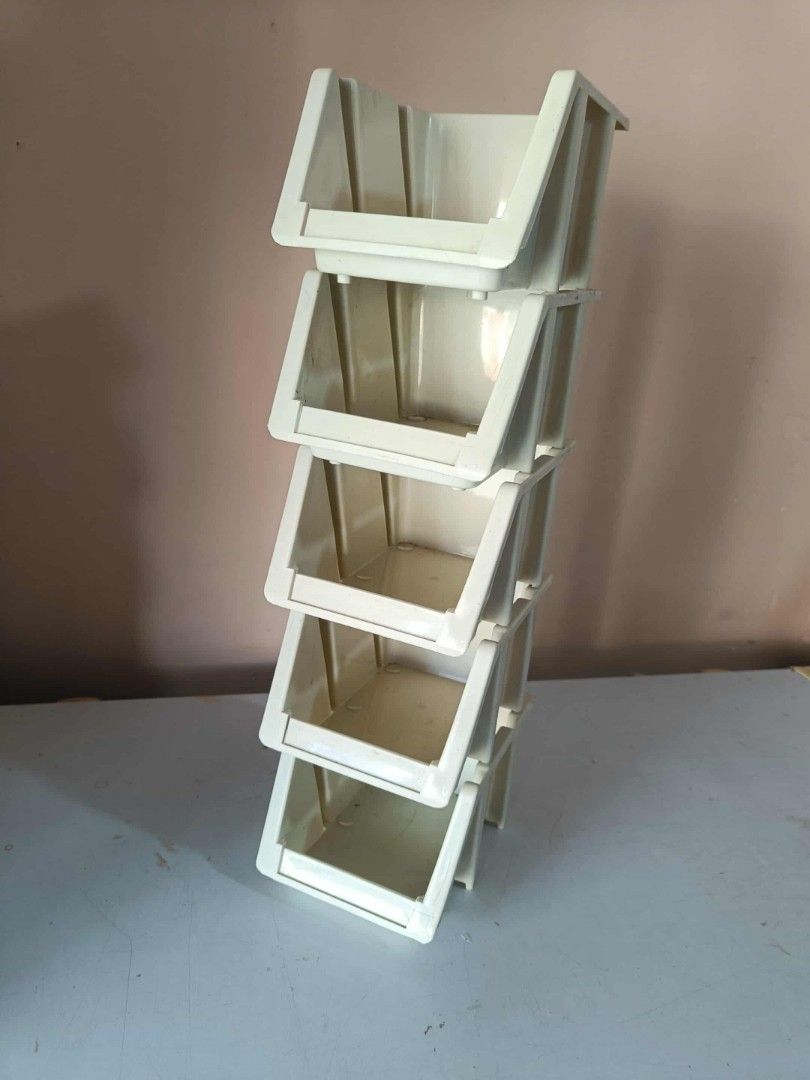Stackable Plastic Storage Bins (Category: Storage Boxes & Baskets) located in Manila. Submitted by katrinasfa27852 (Listing ID 1397354805, Image 3). Description: - Set of stackable plastic storage bins. - Includes clear bins with slotted sides and off-white bins. - Designed for easy stacking. - Perfect for organizing small items. - Durable and easy to clean..