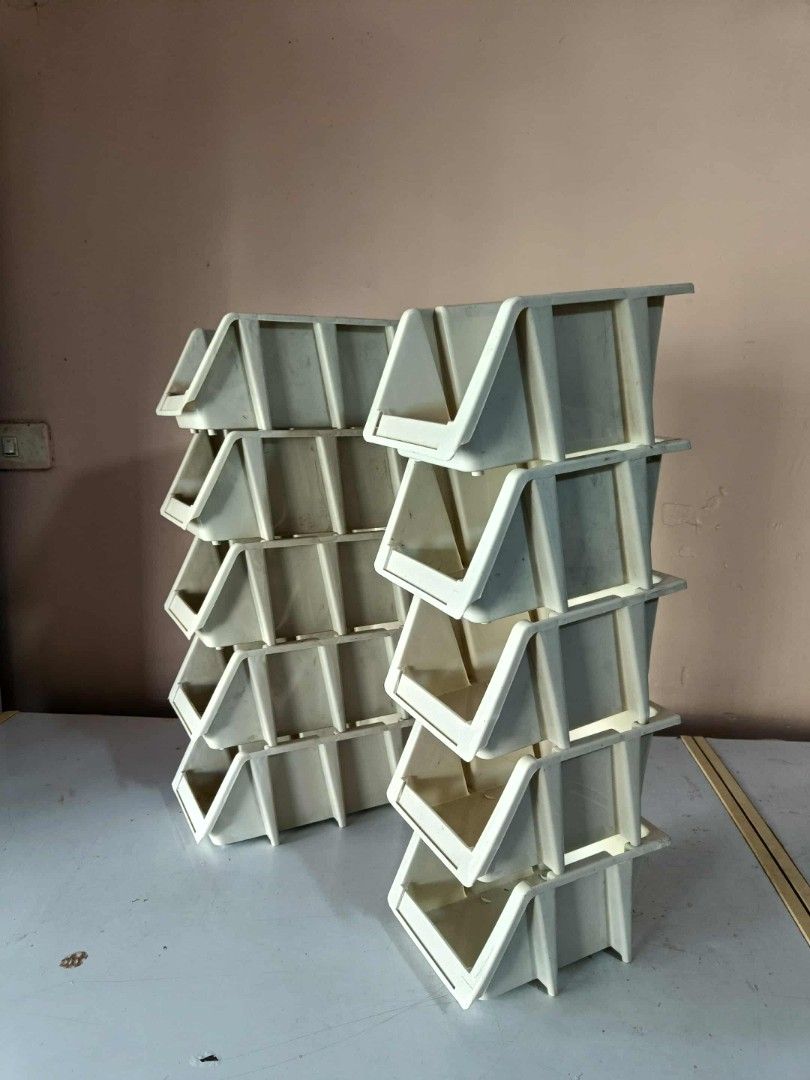 Stackable Plastic Storage Bins (Category: Storage Boxes & Baskets) located in Manila. Submitted by katrinasfa27852 (Listing ID 1397354805, Image 2). Description: - Set of stackable plastic storage bins. - Includes clear bins with slotted sides and off-white bins. - Designed for easy stacking. - Perfect for organizing small items. - Durable and easy to clean..