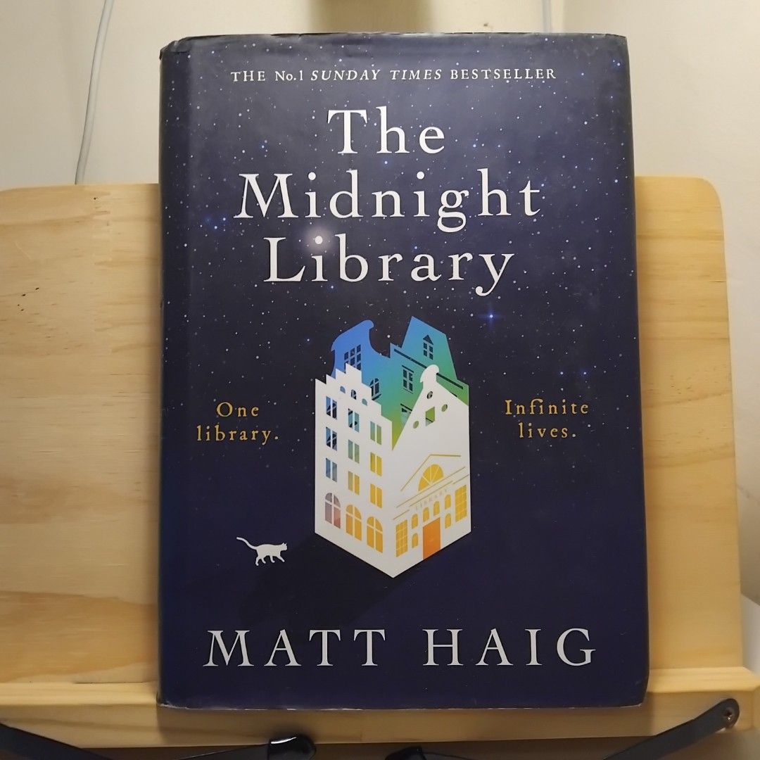The Midnight Library (Hardbound) by Matt Haig (Category: Storybooks) located in Pasig City. Submitted by berto36 (Listing ID 1397277608, Image 1). Description: - "The Midnight Library" by Matt Haig. - Fiction genre. - Pre-loved condition. - Features a unique cover design. - Ideal for readers interested in exploring themes of regret and second chances. - A captivating read filled with warmth and humor..