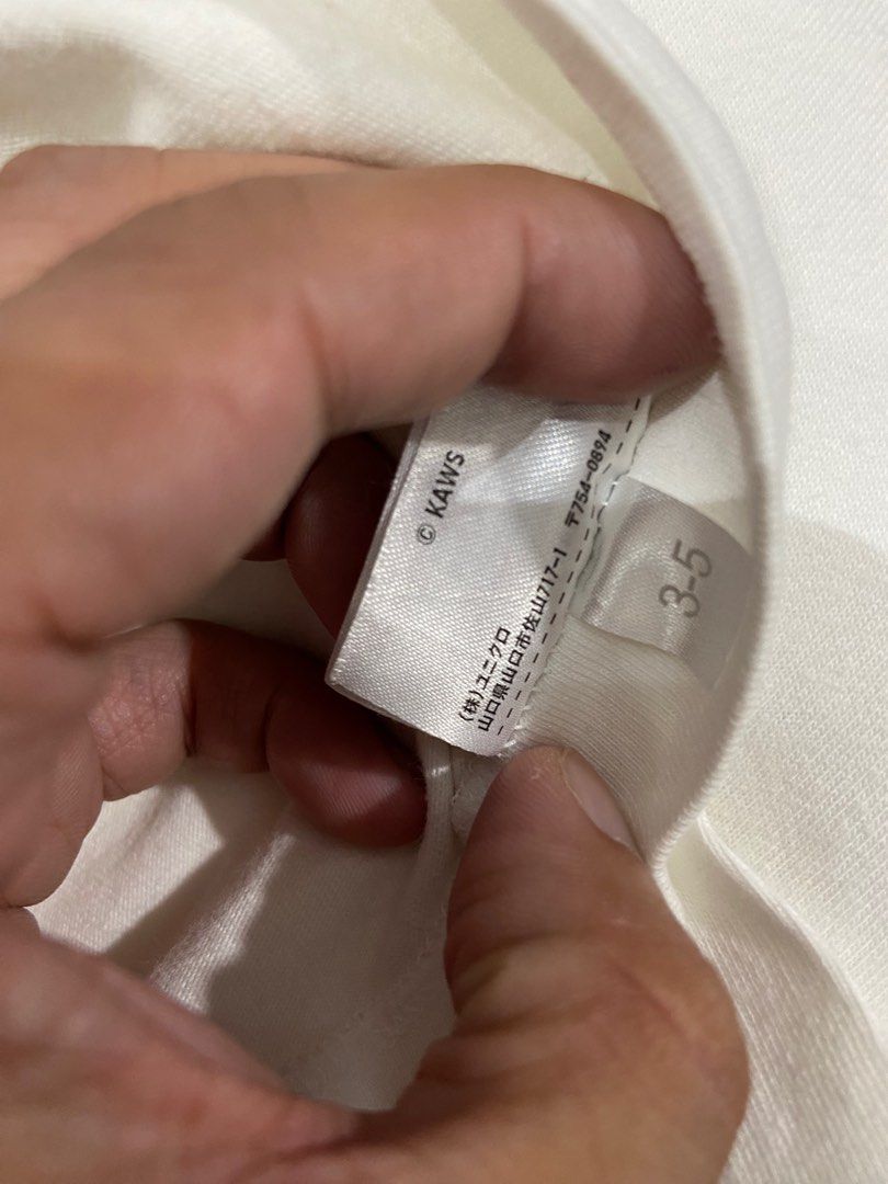 Uniqlo x Kaws Shirt White (Category: Activewear) located in Cebu City. Submitted by jvlz97 (Listing ID 1397256278, Image 3). Description: Excellent Condition Dimes: W20" L 28" .