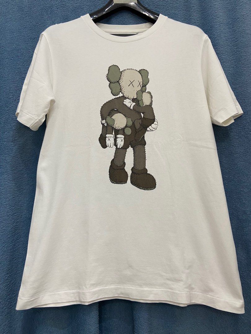 Uniqlo x Kaws Shirt White (Category: Activewear) located in Cebu City. Submitted by jvlz97 (Listing ID 1397256278, Image 1). Description: Excellent Condition Dimes: W20" L 28" .