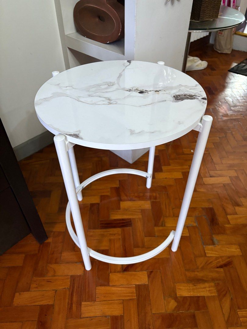 White Marble Top formica Side Table (Category: Tables & Sets) located in Manila. Submitted by jahbey (Listing ID 1397288821, Image 1). Description: - White marble-look tabletop - Round shape - White metal frame with curved legs - Ideal for small spaces - Perfect for drinks, books, or decor - Adds elegance 17in diameter x 23in H.