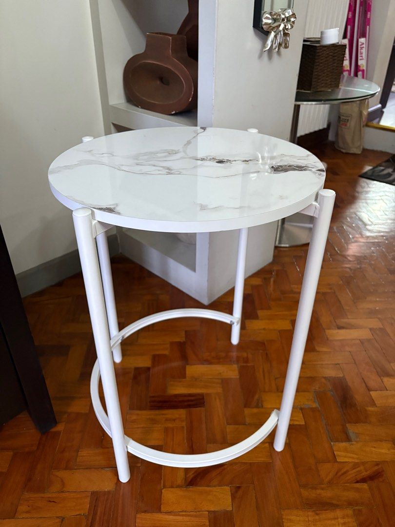 White Marble Top formica Side Table (Category: Tables & Sets) located in Manila. Submitted by jahbey (Listing ID 1397288821, Image 2). Description: - White marble-look tabletop - Round shape - White metal frame with curved legs - Ideal for small spaces - Perfect for drinks, books, or decor - Adds elegance 17in diameter x 23in H.