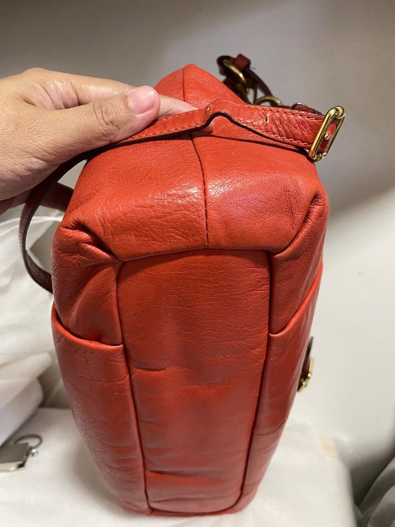 Authentic Coach Madison Isabelle burnt orange leather 2way (Category: Luxury Bags & Wallets) located in Guiguinto. Submitted by prelovedinc2024 (Listing ID 1401671094, Image 3). Description: guaranteed authentic, bought in Japan with signs of use - faded hardwares/with scratches, with creases, pressmarks, rubs, stains inside size: approx 13x12.5x4.5”.