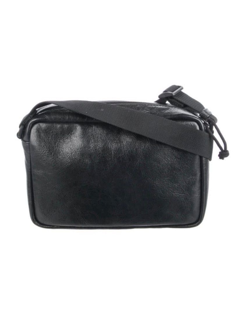 Balenciaga Everyday Camera Bag (Category: Luxury Bags & Wallets) located in Muntinlupa City. Submitted by universonline (Listing ID 1401670706, Image 3). Description: - Balenciaga Everyday Camera Bag - Black leather - Zip closure - Adjustable shoulder strap - Balenciaga logo on front - Rectangular shape - Front pocket Please check my other listings :-).