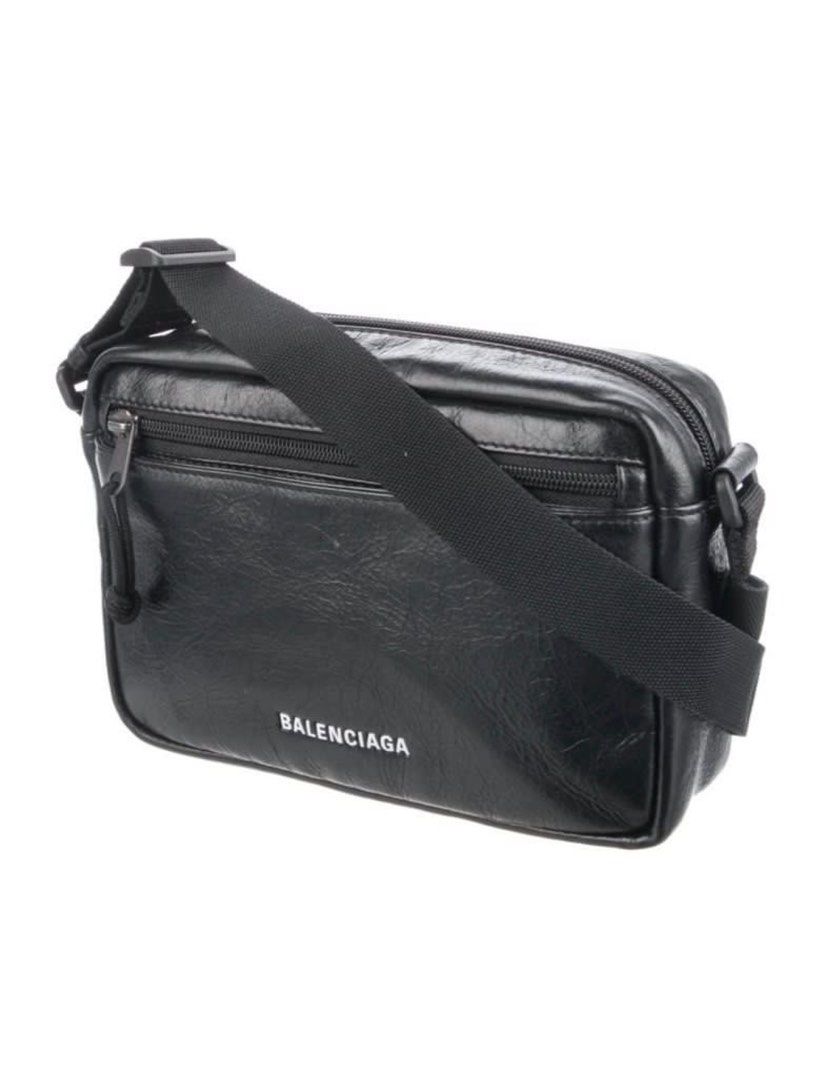 Balenciaga Everyday Camera Bag (Category: Luxury Bags & Wallets) located in Muntinlupa City. Submitted by universonline (Listing ID 1401670706, Image 2). Description: - Balenciaga Everyday Camera Bag - Black leather - Zip closure - Adjustable shoulder strap - Balenciaga logo on front - Rectangular shape - Front pocket Please check my other listings :-).