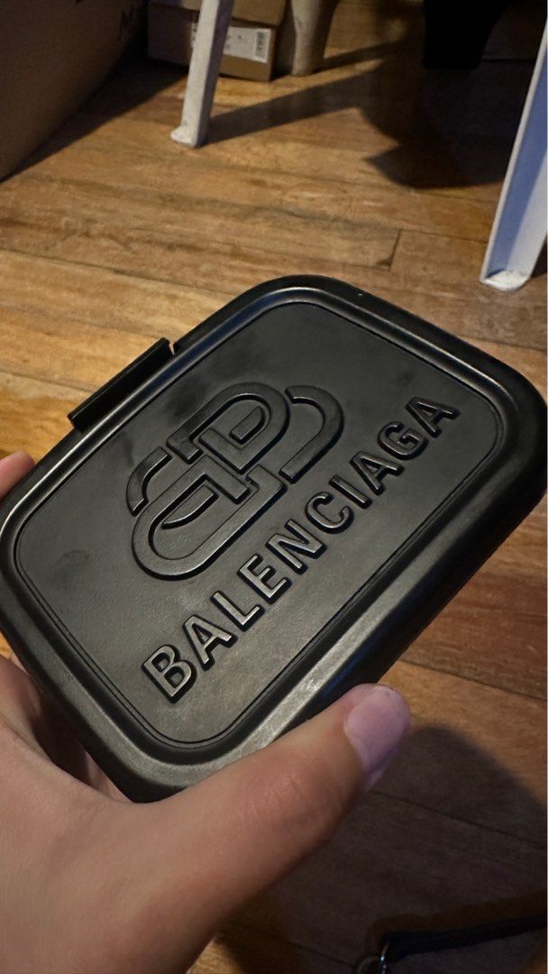 Balenciaga mini lunch box bag (Category: Luxury Bags & Wallets) located in Quezon City. Submitted by area008 (Listing ID 1401592333, Image 3). Description: BALENCIAGA mini lunch box bag Condition 8/10 AUTHENTIC Flaws: • Right clasp for the strap nasira siya pero pwede pa siya ipagawa • Replacement strap na lang yung meron because someone lost the original one (This strap is from Alyx) • No dust bag I can provide a video of the item and more photo