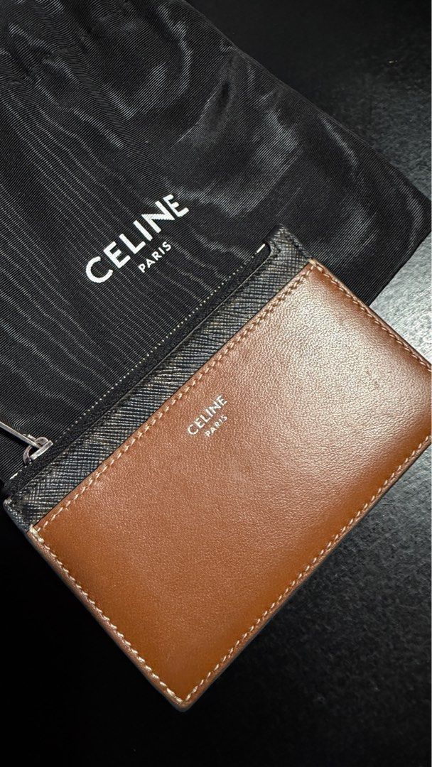 Celine Card Holder with Zipper (Category: Luxury Bags & Wallets) located in Muntinlupa City. Submitted by universonline (Listing ID 1401666839, Image 2). Description: - Authentic Celine card holder - Brown monogram design - Zippered closure - Includes dust bag - Multiple card slots - Zippered compartment for coins - Celine logo visible Please check my other listings :-).