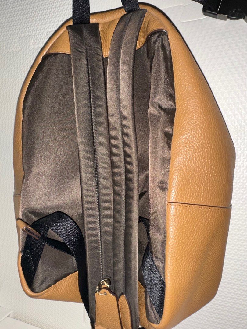 Coach medium Leather Backpack (Category: Luxury Bags & Wallets) located in San Juan City. Submitted by smartfindsph (Listing ID 1401543361, Image 2). Description: - Authentic Coach backpack - Made of brown leather - Front zippered pocket - Main compartment with zipper closure - Adjustable shoulder straps - Top handle - Lined interior - Coach logo on front Only flaw: strap colors a bit faded All in all still very nice.