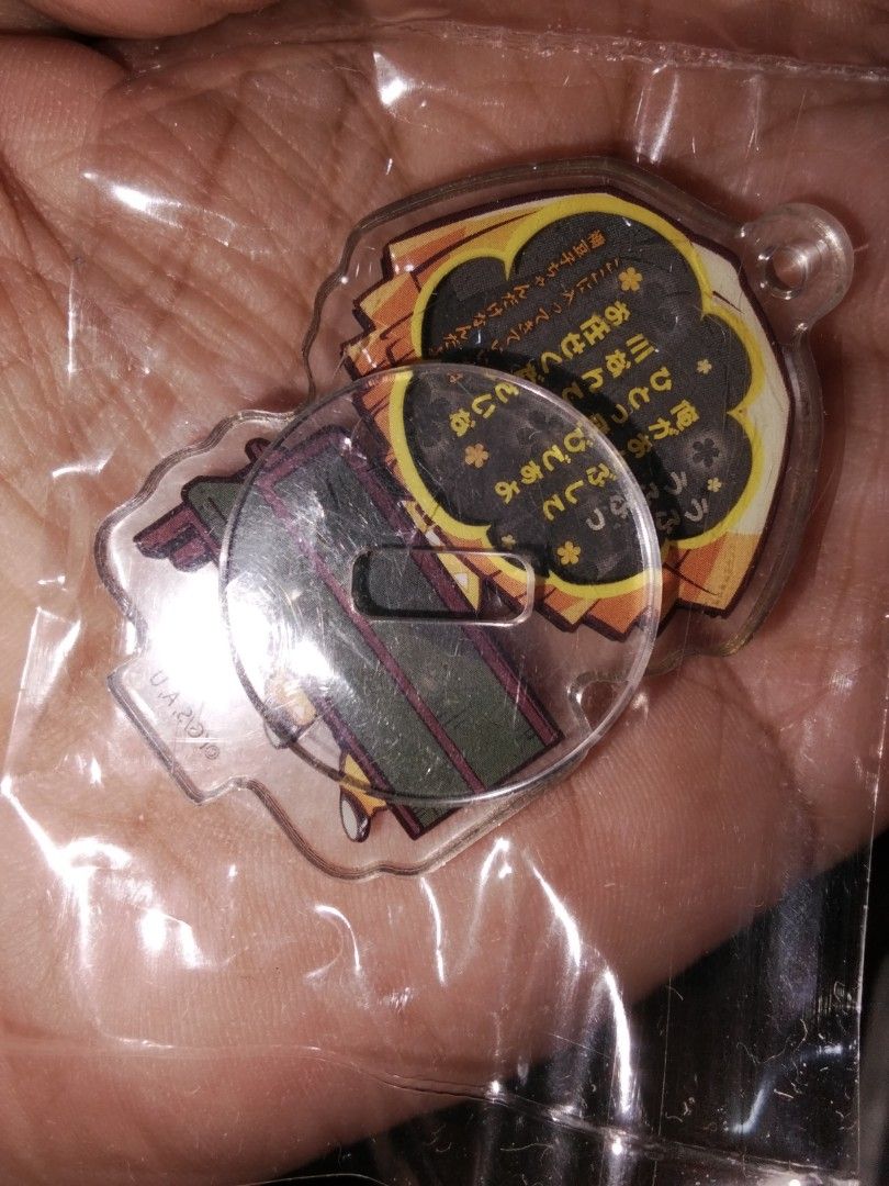 Demon Slayer Zenitsu Acrylic Keychain (Category: Character Goods) located in Santa Rosa. Submitted by animemerchcollection (Listing ID 1401640832, Image 2). Description: - Demon Slayer Zenitsu acrylic keychain - Brand new, still in original packaging - Features a clear, transparent design - Showcases a colorful image of Zenitsu sitting on a bench - Japanese text on the back - A must-have collectible for Demon Slayer fans!.