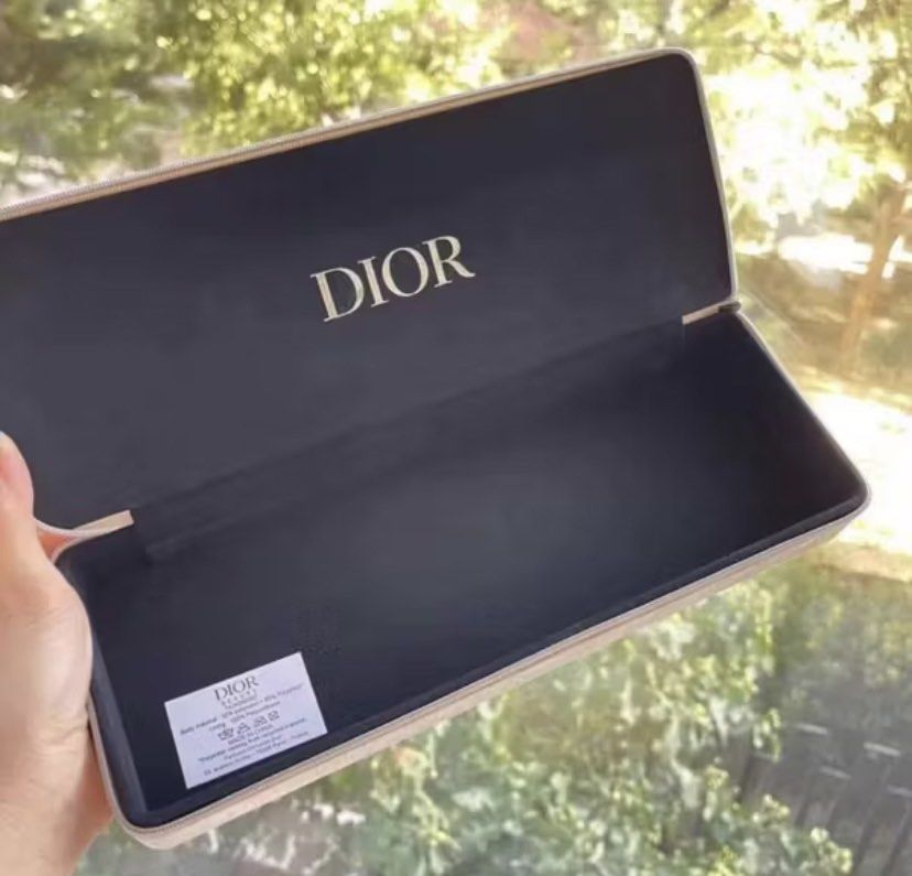 Dior Jewelry/Accessories Case (Category: Luxury Bags & Wallets) located in Bocaue. Submitted by gaille29 (Listing ID 1401662561, Image 3). Description: - Authentic Dior eyeglass case - Gold-toned exterior with Dior logo - Includes original white box - Dark fabric interior - Features a tag - Zipper closure.