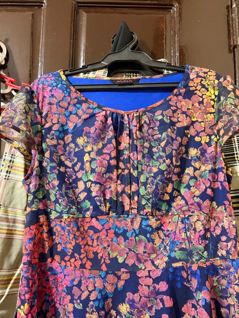 Floral Print Dress (Category: Dresses) located in Manila. Submitted by orion_declutter (Listing ID 1401652574, Image 2). Description: - Maia floral dress - Navy blue base with colorful floral print - Round neckline - Short sleeves - Side zipper closure - Blue inner lining - Suitable for special occasions and everyday wear With minor damage. See last pic.