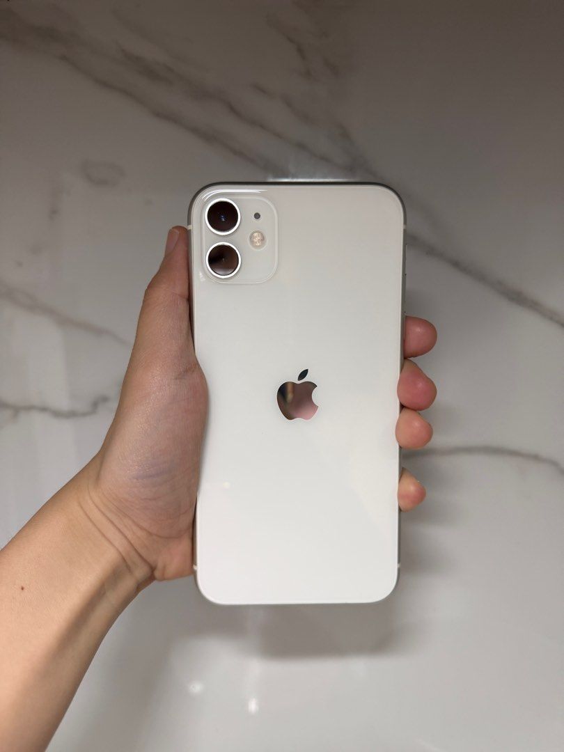 iPhone 11 64 GB White (Category: iPhone 11 Series) located in Pasig City. Submitted by thriftbenefit (Listing ID 1401704122, Image 1). Description: Battery Health 75% No issues Bought July 2022 No history of repair Tiny dent - see last photo Meet-up or arrange pick-up at Funhan Mart Pasig.