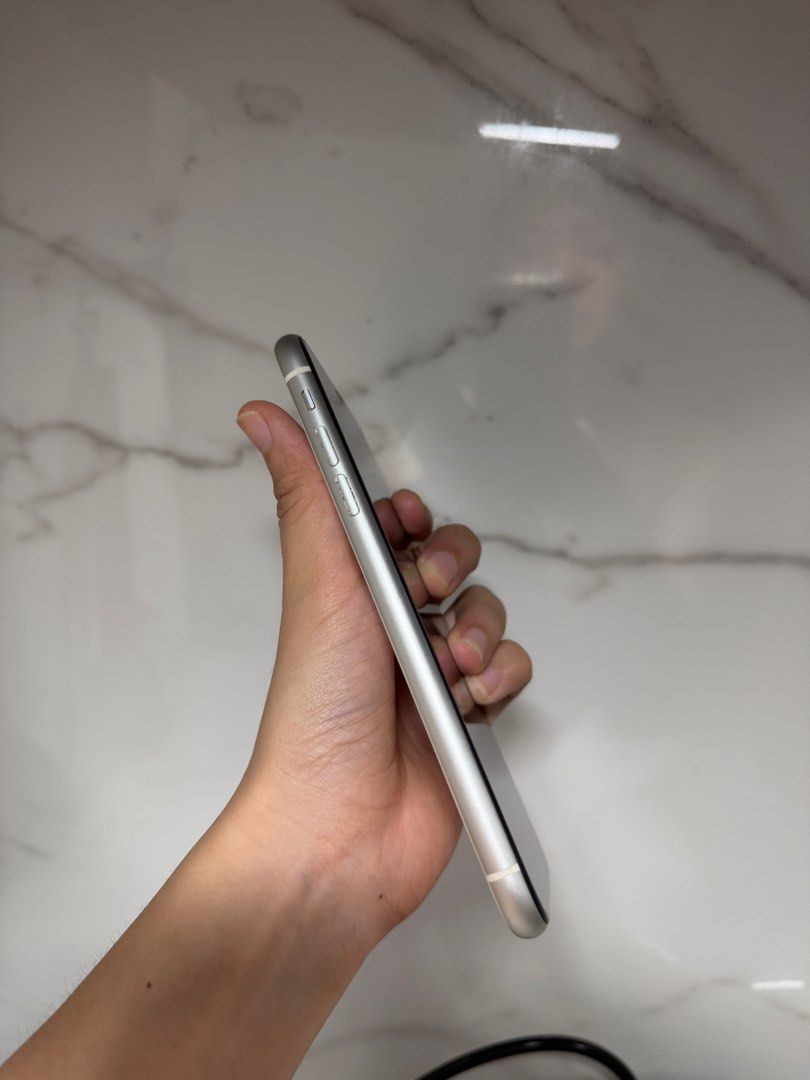 iPhone 11 64 GB White (Category: iPhone 11 Series) located in Pasig City. Submitted by thriftbenefit (Listing ID 1401704122, Image 3). Description: Battery Health 75% No issues Bought July 2022 No history of repair Tiny dent - see last photo Meet-up or arrange pick-up at Funhan Mart Pasig.