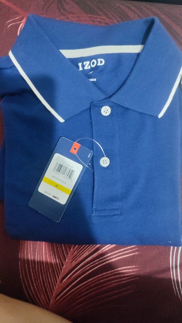 IZOD Polo Shirt - Medieval Blue - Medium (Category: Tshirts & Polo Shirts ) located in Bulacan. Submitted by Domozz (Listing ID 1401549198, Image 2). Description: - IZOD polo shirt - Color: Medieval Blue - Size: Medium - Classic polo collar with white trim - Two-button placket - IZOD logo on collar - Brand new with original tag.