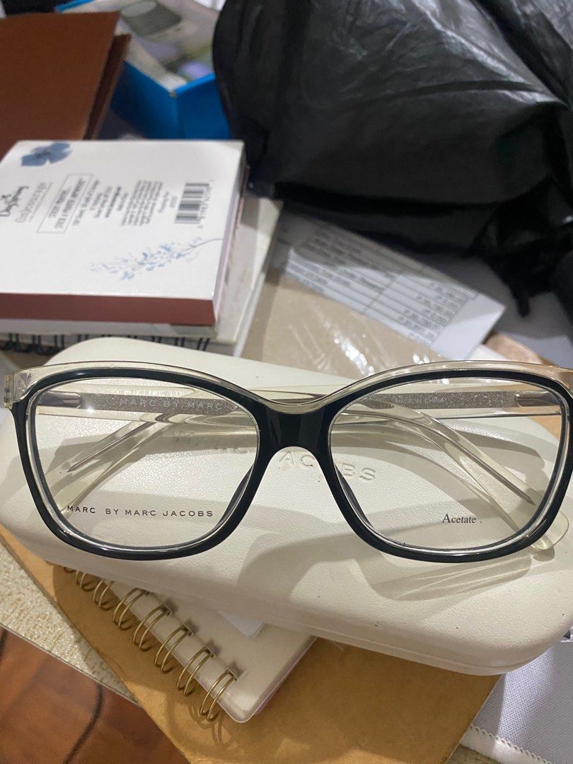 Marc by Marc Jacobs Eyeglasses (Category: Sunglasses & Eyewear) located in Makati City. Submitted by che003 (Listing ID 1401638754, Image 1). Description: - Brand: Marc by Marc Jacobs - Frame: Black acetate - Lenses: Clear - Includes: White case - Features brand logo on frame RFS: Decluttering Never been used (stored only).